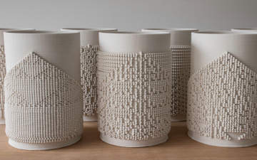 Several 3D-printed ceramic objects next to each other.