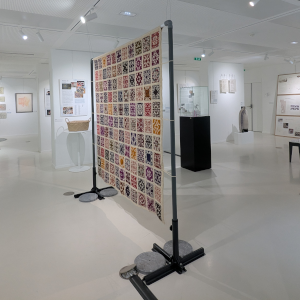 An image of the exhibition space, with Laura Taalman's 'Granny Life' sculpture in the center.